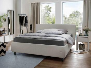 hellgraues Boxspringbett in modernem Schlafzimmer